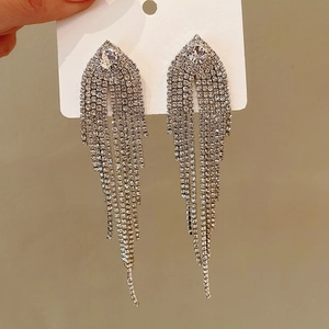 Elegant silver tassel earrings with emerald accents and sparkling rhinestones