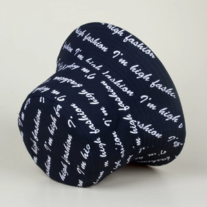 Close-up of high fashion embroidery and stitching on a black cotton bucket hat