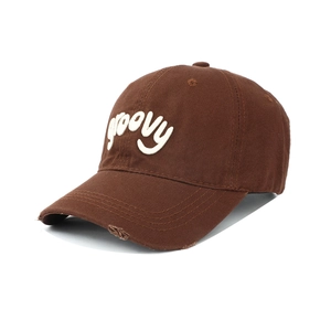 Detail of groovy 3D embroidery and distressed brim on vintage brown baseball cap