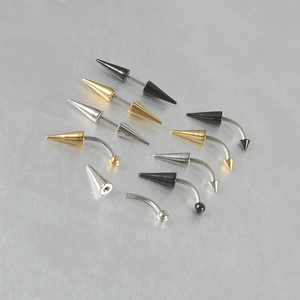Stainless steel eyebrow piercing set in silver gold and black with spikes and balls