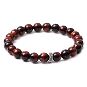 Detailed view of natural red tiger eye beaded bracelet with silver textured spacer bead