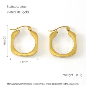 Detail of 18K gold plated stainless steel U-shaped hoop earrings 26mm by 23mm size