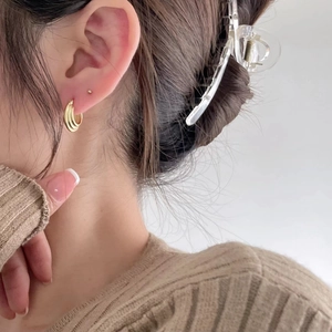Elegant 925 sterling silver triple layer gold hoop earrings worn on female ear