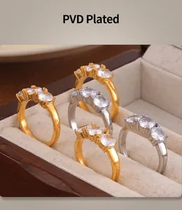 Detail of vintage geometric 18k gold plated rings with micro-set stones in a jewelry box