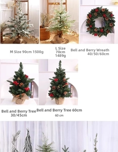 Detail view of mini Christmas trees with red berries, bells and burlap wrapped bases