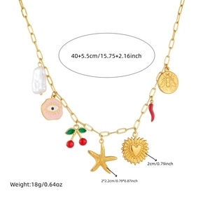 Gold stainless steel necklace with seashell, starfish and cherry charms on white background
