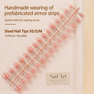 Handmade press-on nails in nude gradient with silver glitter wire and rhinestones