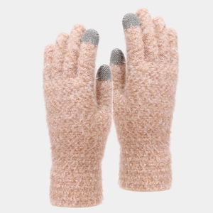 Detailed close-up of pink knit gloves with touch screen tips for cold winter protection