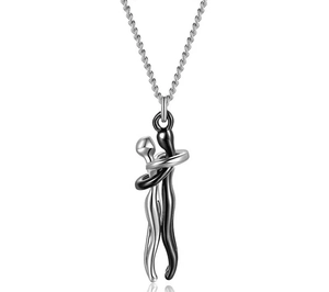 Detail of creative hug pendant necklace showing black and silver polished metal silhouettes