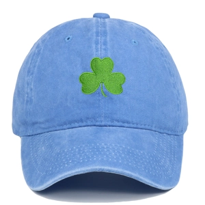 Detail of green clover embroidery on sky blue washed cotton baseball cap with ventilation holes