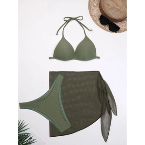Detailed flat lay of an olive green three-piece bikini set with a mesh beach sarong