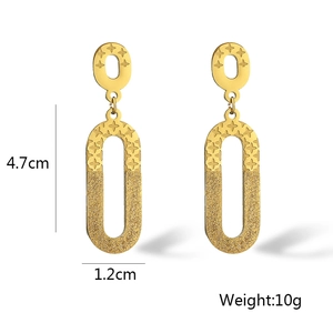 Detail showing irregular gold geometric earrings with dimensions 4.7cm by 1.2cm and 10g weight