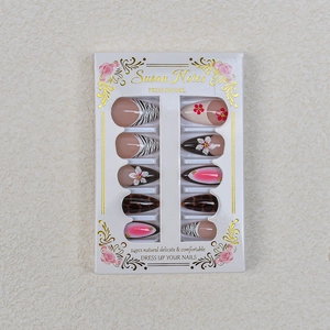 Detail view of 24pcs press-on nails set with zebra print, leopard patterns, and 3D flowers