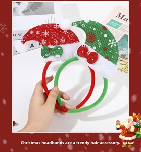 Close-up of red and green sequined Christmas headbands with snowflake patterns and bows