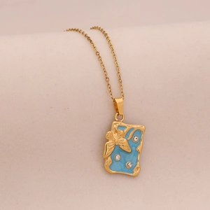 Golden necklace featuring a light blue enamel rectangular pendant with butterfly relief