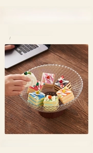 Close-up of diamond textured snack platter with wide opening holding rainbow cakes