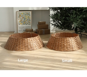 Detail view of large and small brown woven wicker Christmas tree collars in a cozy indoor setting