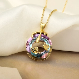 Golden bee and honey drop necklace with a colorful iridescent round crystal pendant