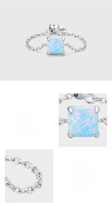 Detailed macro view of S925 sterling silver square opal ring with prong setting