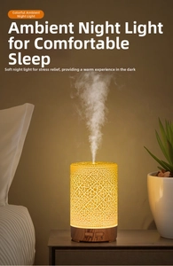 Detail of humidifier with crackle texture warm light and wood grain base control buttons