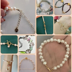 Detail shot of pearl bracelets with 925 silver clasps and floral heart pendants