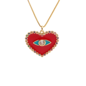 Gold heart necklace with red enamel evil eye and colorful zircon stones on white background