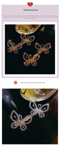 Close-up of sparkling rhinestone butterfly hair clips in gold and silver finish