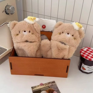 Plush light brown bear slippers with sleeping cap in a cozy home setting decor