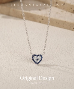 Macro view of S925 sterling silver heart pendant with blue and white crystals