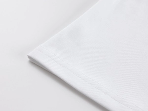 Close-up of white ribbed knit fabric hem with durable double-needle stitching detail