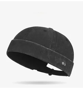 Detail view of the Good Day embroidery and washed canvas texture on the black Miki hat