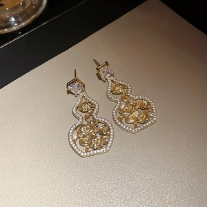 Elegant gold hollow gourd drop earrings with sparkling zircon crystals and floral patterns