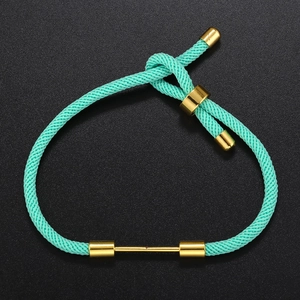 Detail of teal braided bracelet with adjustable gold sliding clasp and metal end caps