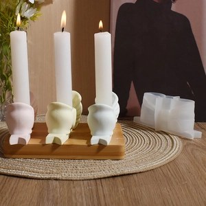 DIY silicone mold for bowknot-shaped scented candle holder shown with colorful finished products