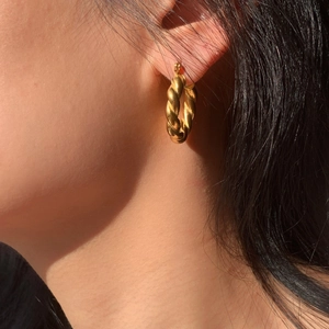 18K gold plated stainless steel croissant hoop earrings featuring a twisted texture design