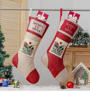 Detailed view of rustic burlap Christmas stockings with letters to Santa and festive text