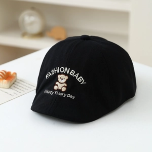 Detail of black cotton canvas kids flat cap with bear embroidery and fashion lettering