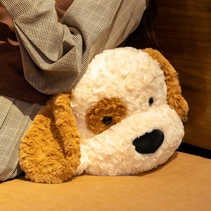 Close-up of the fluffy dual-tone plush dog toy featuring soft curly faux fur texture