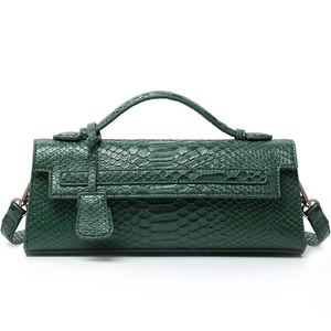 Deep green snake skin texture baguette bag with adjustable strap and metallic hardware