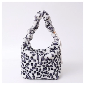 Detail of plush leopard print shoulder bag with purple faux fur and drawstring charm