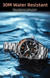 Detail of waterproof men's diving watch with luminous dial and orange rotating bezel