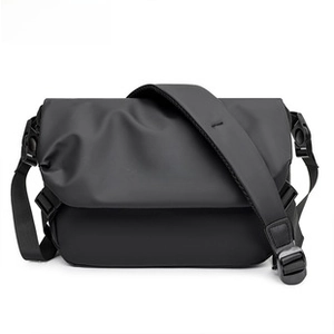 Detailed close-up of a black waterproof oxford cloth chest bag with flap and buckle closure