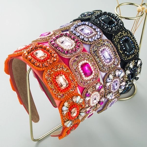 Detail of baroque headbands with vibrant beads, crystals, and geometric rhinestones