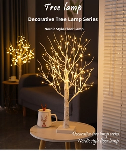 Detail of warm yellow LED beads on white minimalist Nordic style decorative tree light