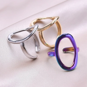 Three minimalist stainless steel open rings in gold, silver, and iridescent purple