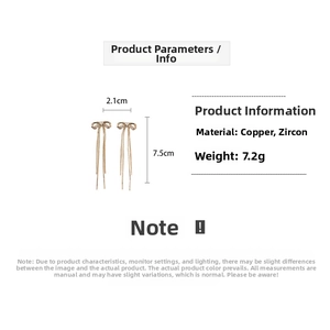 Detail view of 18K gold plated bow tassel earrings with dimensions 2.1cm by 7.5cm