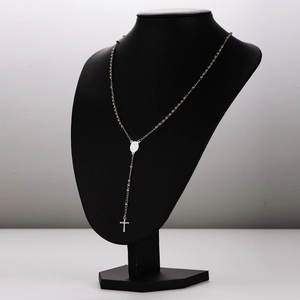 Y-shaped stainless steel rosary necklace with 3mm beads and cross tassel on a model