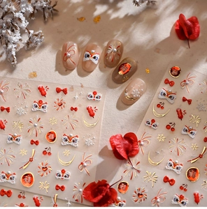 Macro detail of Lunar New Year nail stickers featuring lion dance and lucky Fu motifs