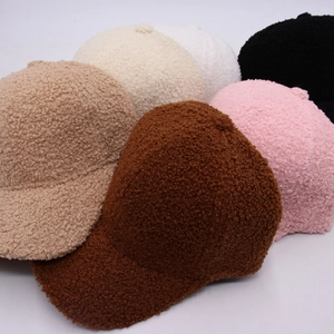Detailed pile of lamb wool baseball caps in brown beige pink and black colors