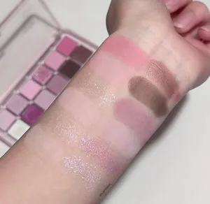 Arm swatches showing 12-color pink and purple eyeshadow palette with matte and shimmer finish